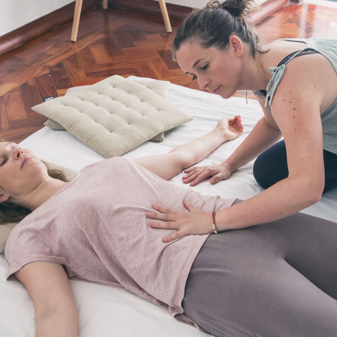 Katrin demonstrating abdominal Thai Massage technique