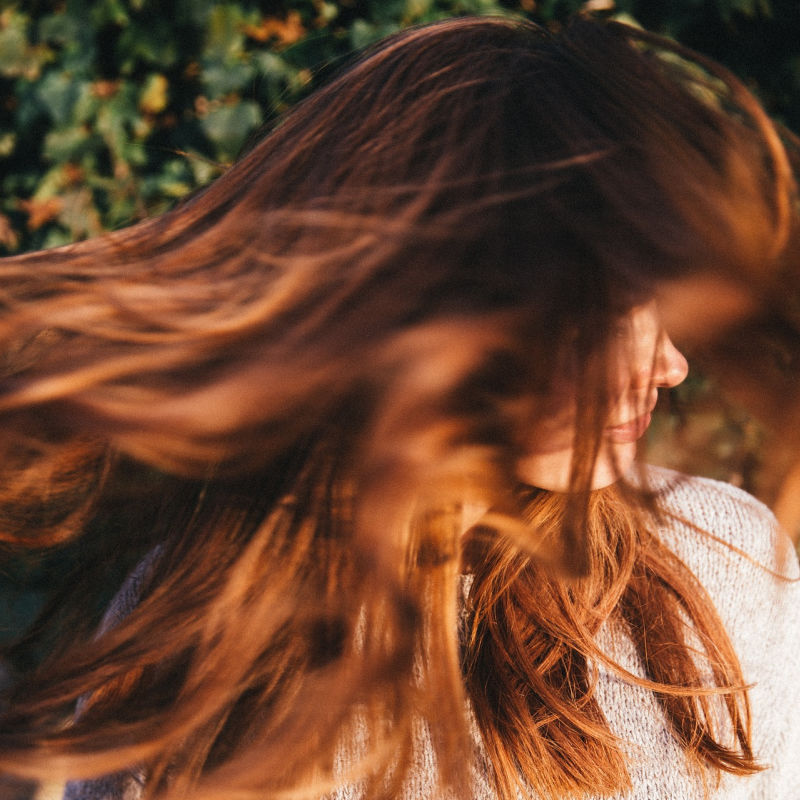 woman shaking out hair